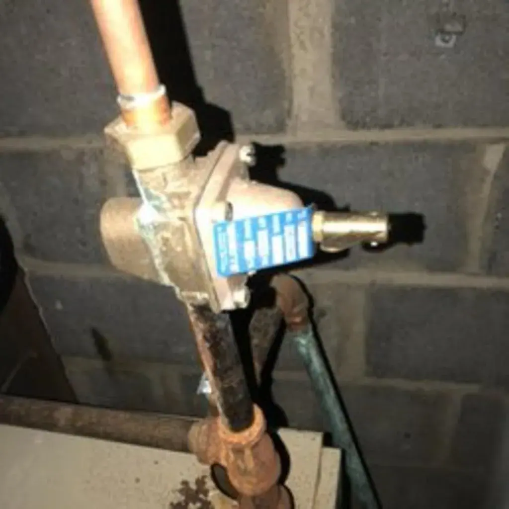 Boiler water feed valve on basement piping in Westchester County, NY