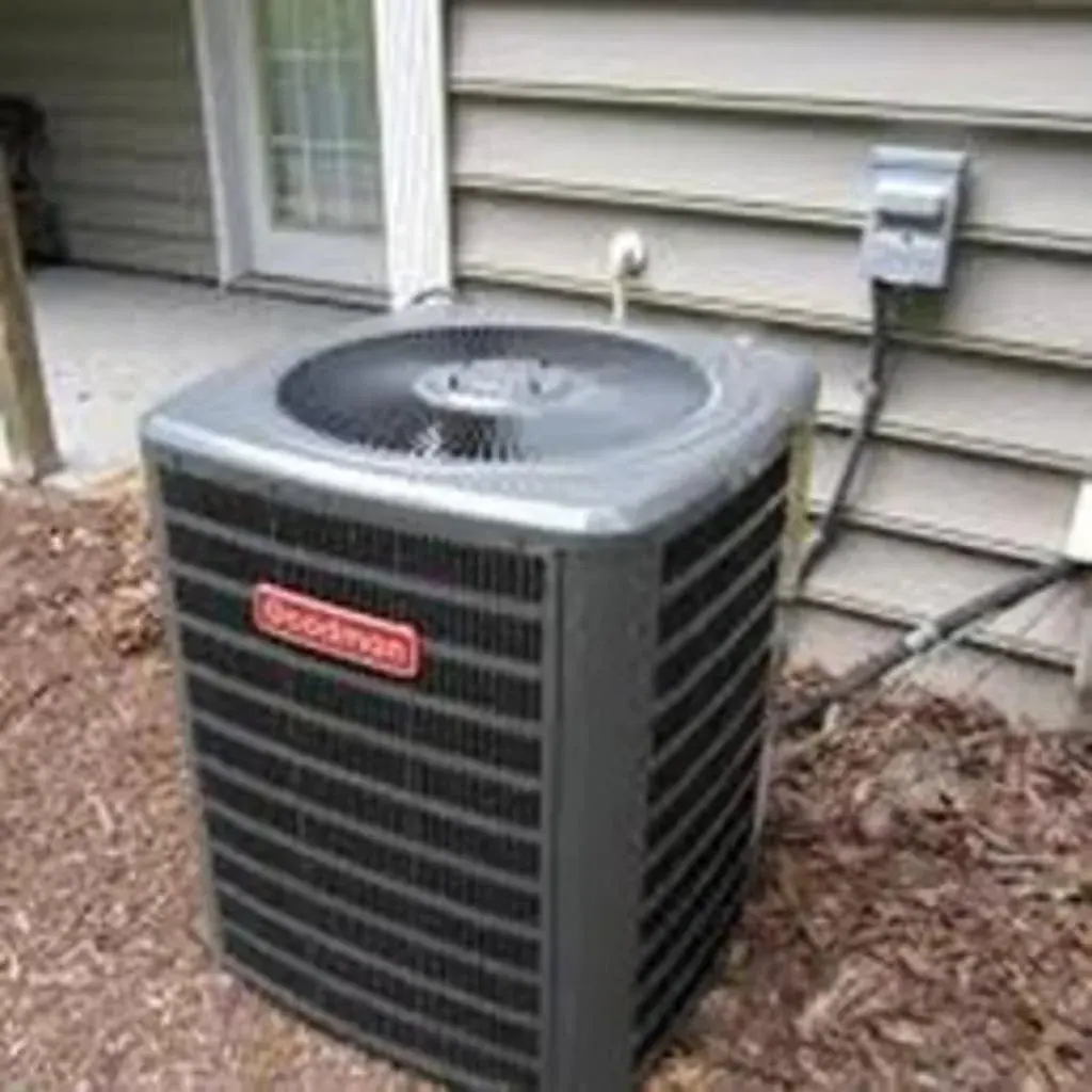 Goodman AC condenser on a concrete pad beside a home in White Plains, NY