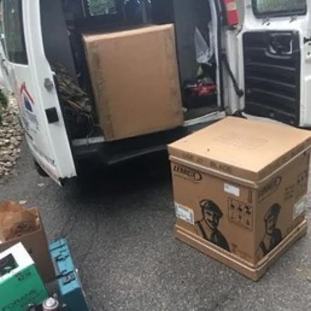 New Lennox HVAC equipment boxes unloaded from a service van for an installation near White Plains, NY